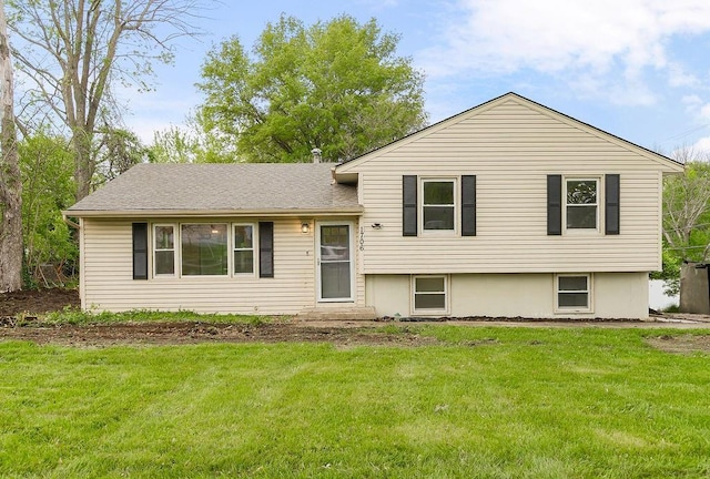 split level home with a front lawn