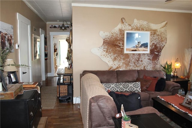 living area with dark wood-style floors and crown molding