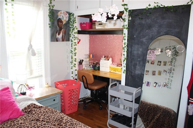 bedroom featuring wood finished floors