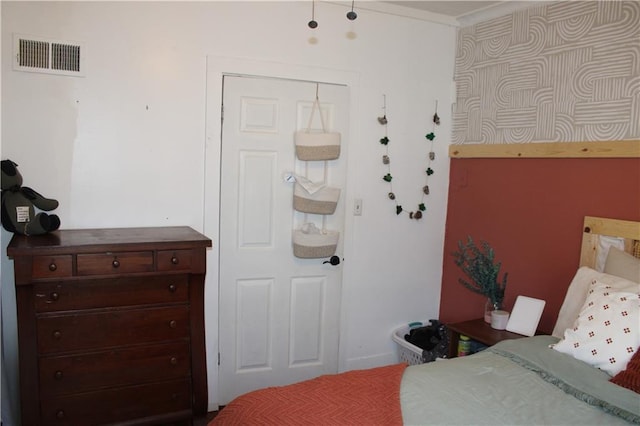 bedroom featuring visible vents