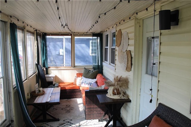 sunroom featuring track lighting