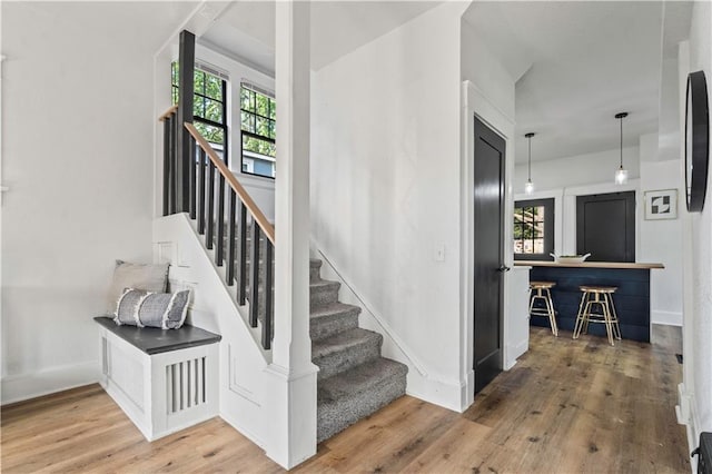 stairs featuring baseboards and wood finished floors