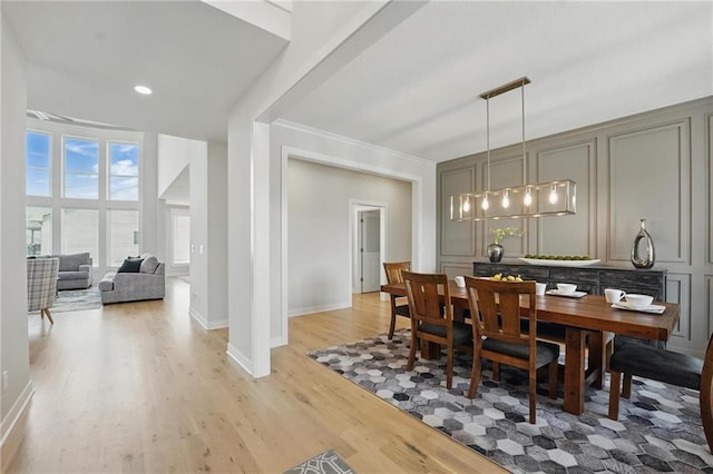 1312 NW 107th Ter, Kansas City, MO 64155 - dining space with light wood finished floors, crown molding, baseboards, and recessed lighting