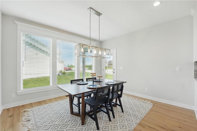 1312 NW 107th Ter, Kansas City, MO 64155 - dining room with plenty of natural light, a chandelier, and baseboards