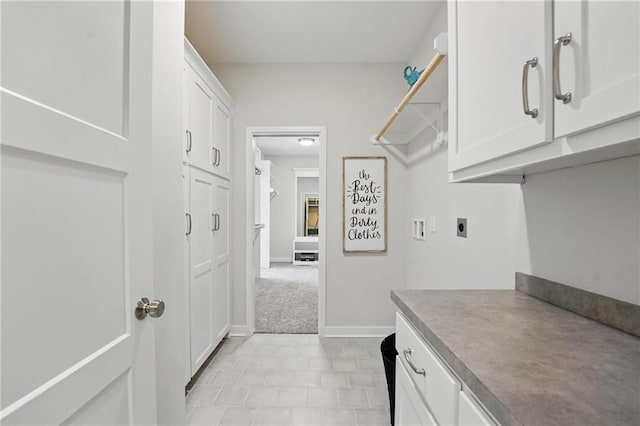 1312 NW 107th Ter, Kansas City, MO 64155 - laundry area with electric dryer hookup, cabinet space, and hookup for a washing machine