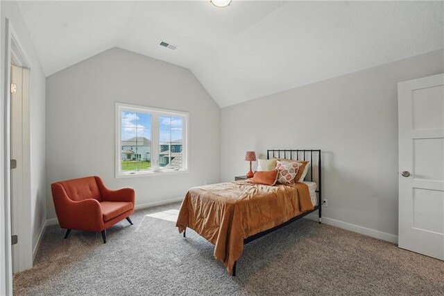 1312 NW 107th Ter, Kansas City, MO 64155 - carpeted bedroom featuring lofted ceiling and baseboards