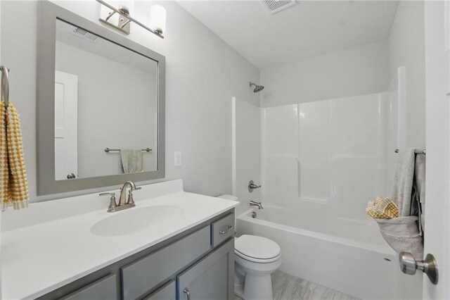 1312 NW 107th Ter, Kansas City, MO 64155 - full bathroom featuring vanity, toilet, and bathtub / shower combination