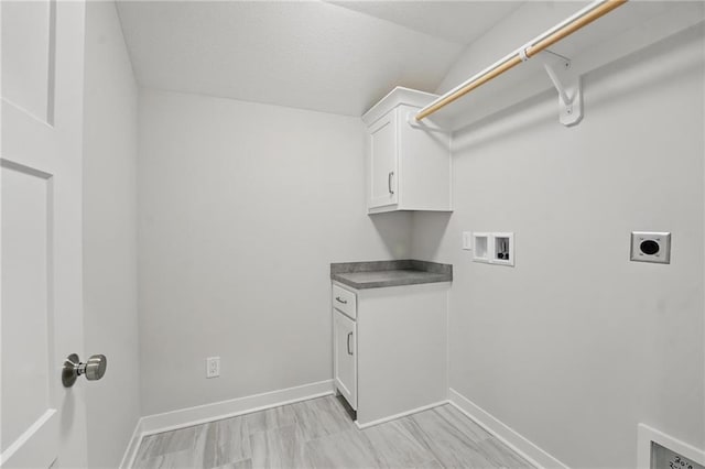 1312 NW 107th Ter, Kansas City, MO 64155 - laundry room featuring hookup for an electric dryer, washer hookup, baseboards, and cabinet space