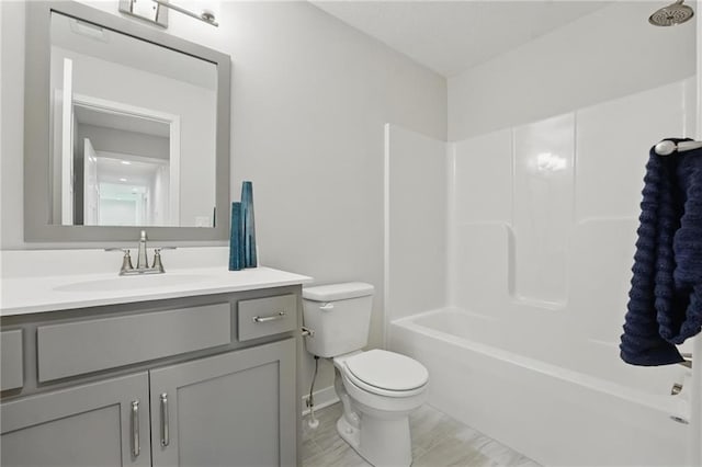 1312 NW 107th Ter, Kansas City, MO 64155 - bathroom with toilet, vanity, baseboards, and  shower combination