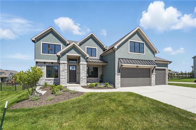 1312 NW 107th Ter, Kansas City, MO 64155 - view of front of home with a standing seam roof, driveway, an attached garage, stucco siding, and stone siding
