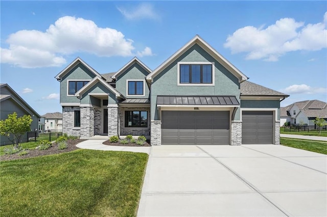 1312 NW 107th Ter, Kansas City, MO 64155 - view of front of property with concrete driveway, a standing seam roof, stone siding, and an attached garage