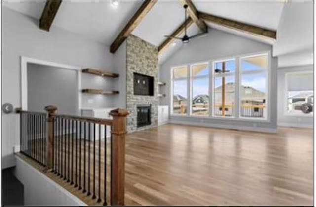 2319 SW Serena Pl, Lees Summit, MO 64082 - living area featuring wood finished floors and a fireplace