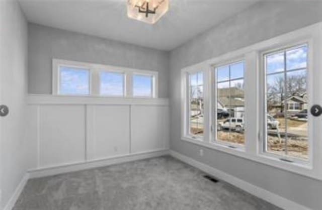 2319 SW Serena Pl, Lees Summit, MO 64082 - spare room with carpet and baseboards