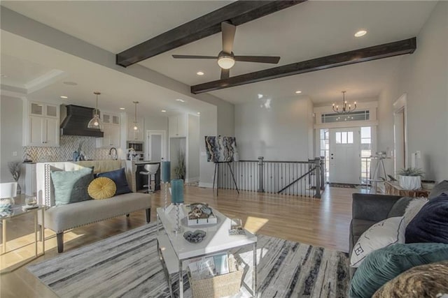 2303 SW Serena Pl, Lees Summit, MO 64082 - living room with light wood-style floors, beam ceiling, recessed lighting, a chandelier, and a ceiling fan