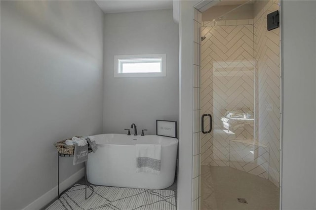 2303 SW Serena Pl, Lees Summit, MO 64082 - full bathroom with a freestanding tub, a shower stall, and baseboards