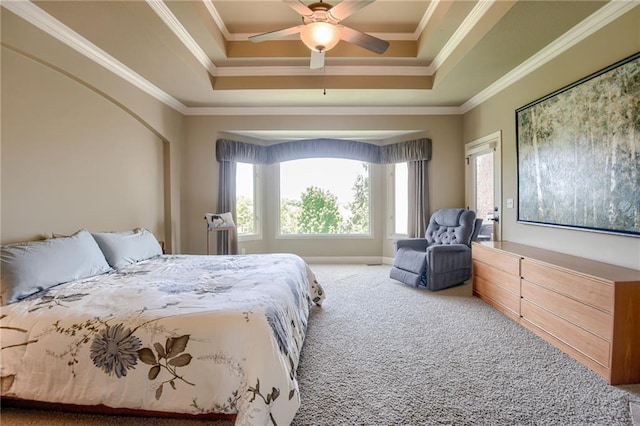 bedroom featuring carpet floors, a raised ceiling, crown molding, and ceiling fan