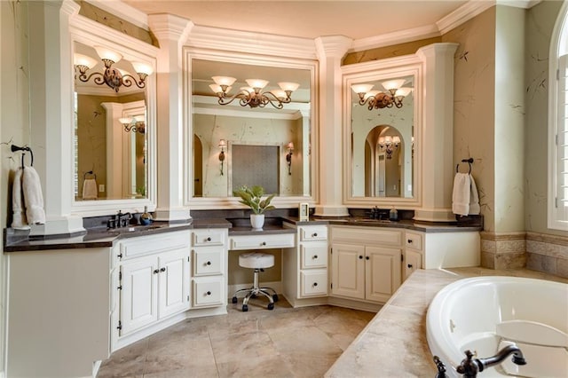 bathroom with vanity, crown molding, and a bath