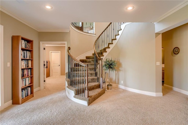 stairway with baseboards, ornamental molding, carpet flooring, and recessed lighting