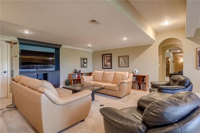 living area featuring crown molding, light colored carpet, arched walkways, recessed lighting, and visible vents