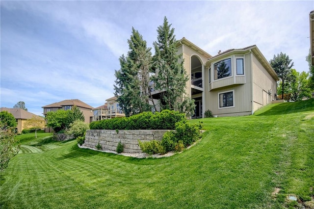 rear view of property featuring a yard