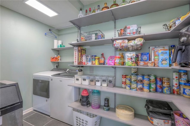 laundry area featuring tile patterned flooring and washing machine and clothes dryer