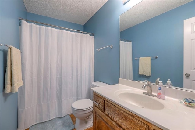 full bath featuring vanity, a textured ceiling, toilet, and a shower with curtain