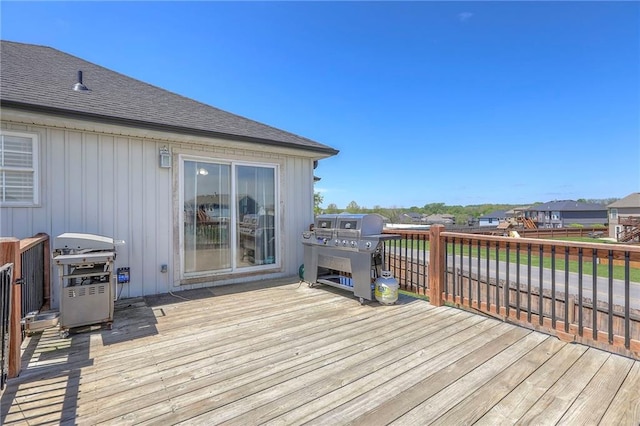wooden terrace featuring grilling area
