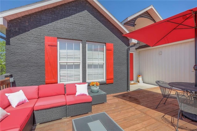 wooden deck with an outdoor living space and outdoor dining area