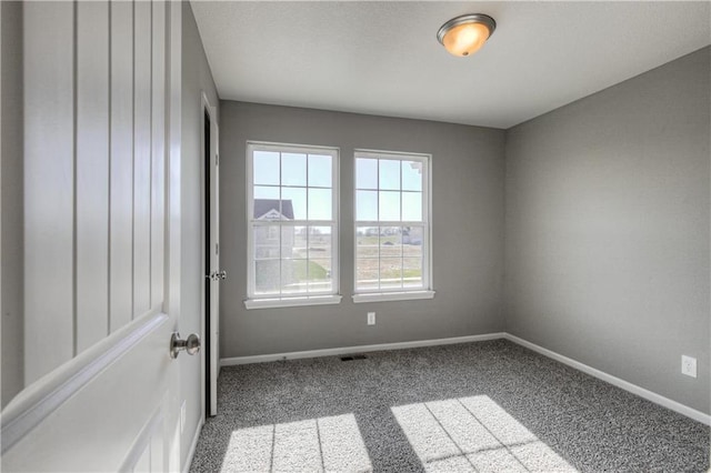6022 NE 118th Ter, Kansas City, MO 64156 - empty room with baseboards, carpet flooring, and visible vents
