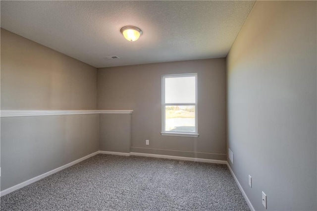 6022 NE 118th Ter, Kansas City, MO 64156 - empty room featuring a textured ceiling, carpet, baseboards, and visible vents