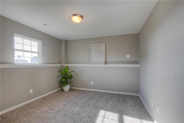 6022 NE 118th Ter, Kansas City, MO 64156 - unfurnished room featuring baseboards, carpet flooring, and visible vents