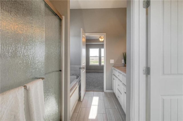 6022 NE 118th Ter, Kansas City, MO 64156 - bathroom with a stall shower, tile patterned floors, vanity, and a bath
