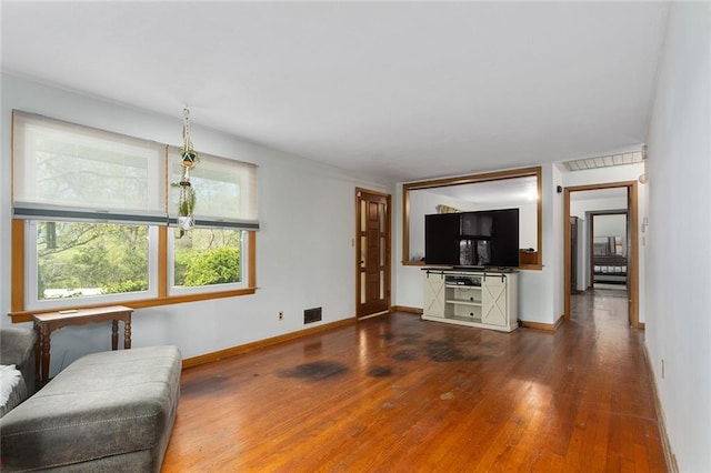 9382 N Cookingham Dr, Kansas City, MO 64157 - living room with baseboards, hardwood / wood-style flooring, and visible vents