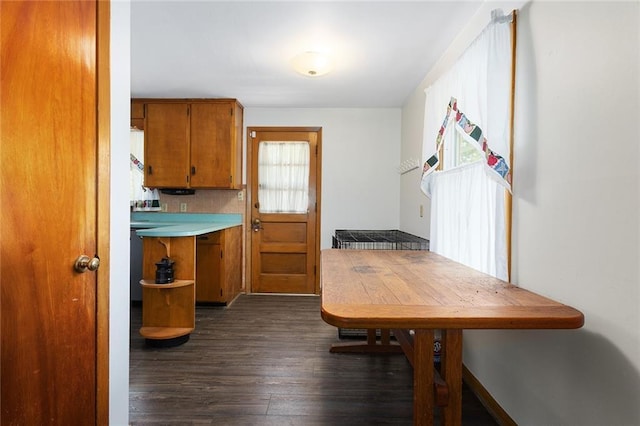 9382 N Cookingham Dr, Kansas City, MO 64157 - kitchen featuring brown cabinets, light countertops, and dark wood-style floors