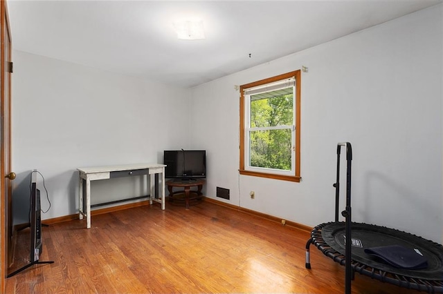 9382 N Cookingham Dr, Kansas City, MO 64157 - misc room featuring visible vents, light wood finished floors, and baseboards