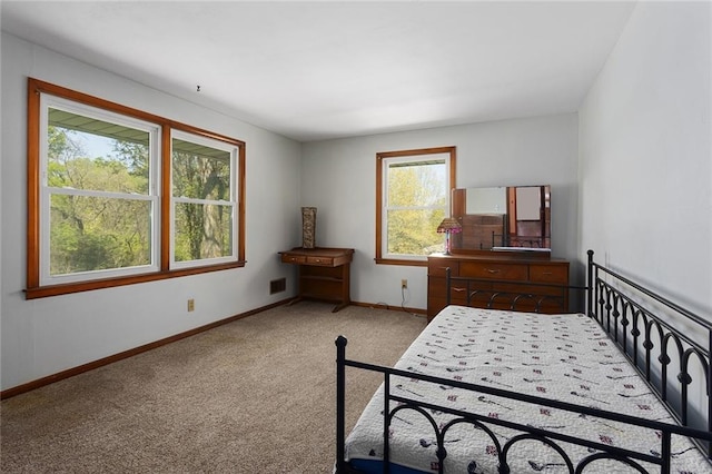 9382 N Cookingham Dr, Kansas City, MO 64157 - bedroom featuring light colored carpet, baseboards, and visible vents