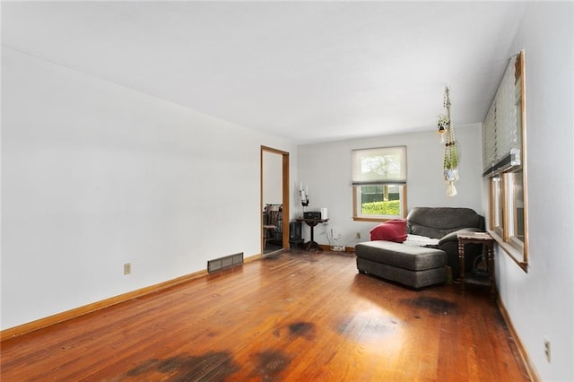 9382 N Cookingham Dr, Kansas City, MO 64157 - living area featuring visible vents, baseboards, and wood finished floors