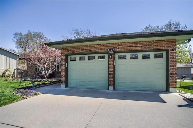 5103 S Shrank Ave, Independence, MO 64055 - garage featuring concrete driveway