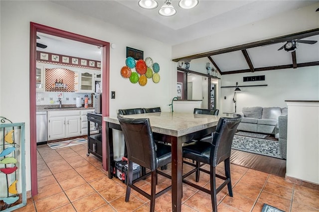 5103 S Shrank Ave, Independence, MO 64055 - dining room with light tile patterned floors and vaulted ceiling