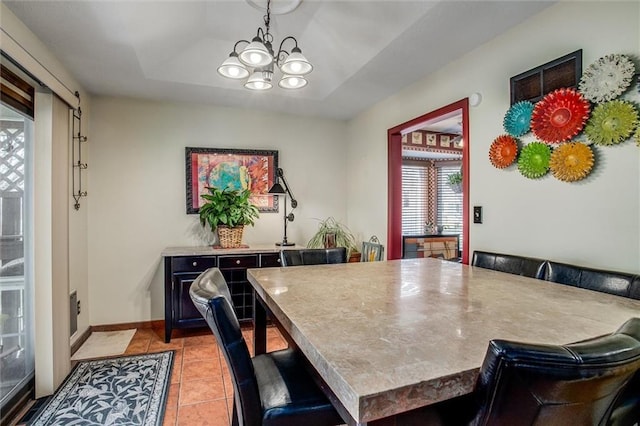 5103 S Shrank Ave, Independence, MO 64055 - dining room with a notable chandelier and light tile patterned floors