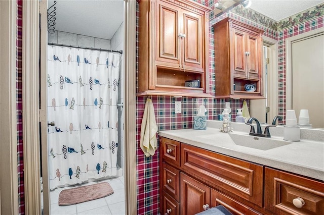 5103 S Shrank Ave, Independence, MO 64055 - bathroom featuring a shower with curtain, tile patterned flooring, vanity, and a textured ceiling