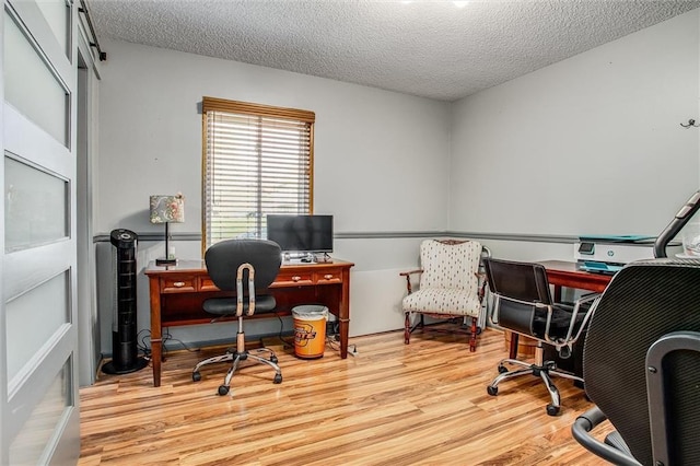 5103 S Shrank Ave, Independence, MO 64055 - office with light wood-type flooring and a textured ceiling