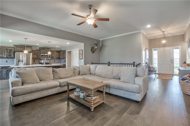 4246 Lakeview Ter, Basehor, KS 66007 - living room featuring dark wood-type flooring, crown molding, ceiling fan, and recessed lighting