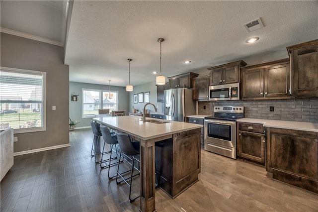 4246 Lakeview Ter, Basehor, KS 66007 - kitchen with light countertops, visible vents, stainless steel appliances, and a sink