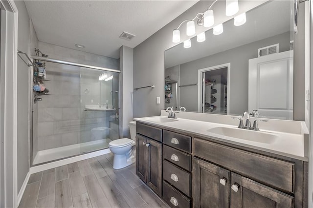 4246 Lakeview Ter, Basehor, KS 66007 - full bathroom with toilet, a sink, and visible vents