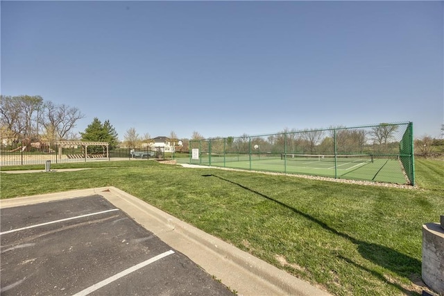 4246 Lakeview Ter, Basehor, KS 66007 - view of property's community with uncovered parking, fence, a yard, and a tennis court