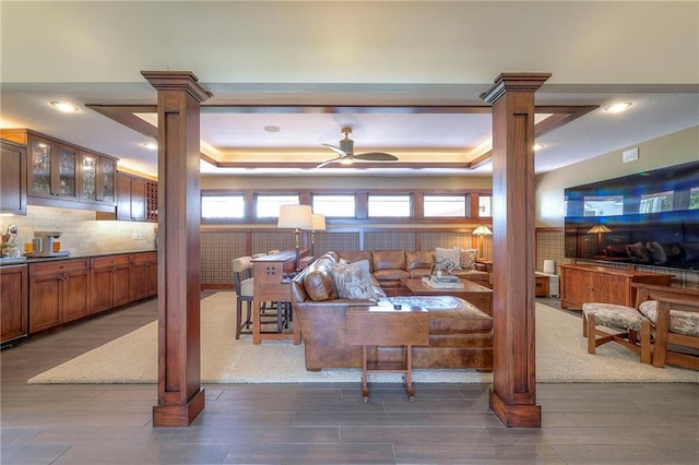 101 Algonquin Dr, Lake Winnebago, MO 64034 - living area with decorative columns, a raised ceiling, wood finished floors, a ceiling fan, and recessed lighting