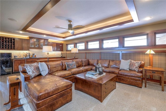 101 Algonquin Dr, Lake Winnebago, MO 64034 - living room with a tray ceiling, wine cooler, and a ceiling fan