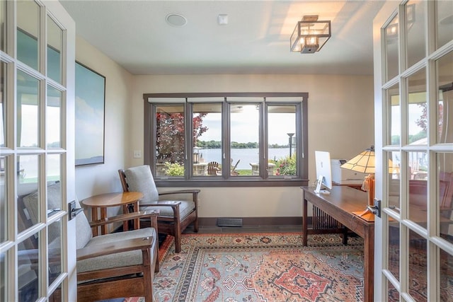 101 Algonquin Dr, Lake Winnebago, MO 64034 - home office with baseboards, a water view, and french doors