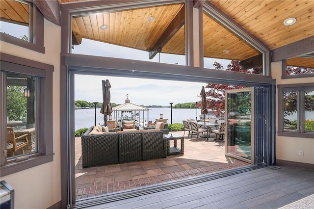 101 Algonquin Dr, Lake Winnebago, MO 64034 - sunroom / solarium featuring a water view, healthy amount of natural light, and beamed ceiling